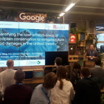 Dr. Ollie Wing presenting at the Google stand